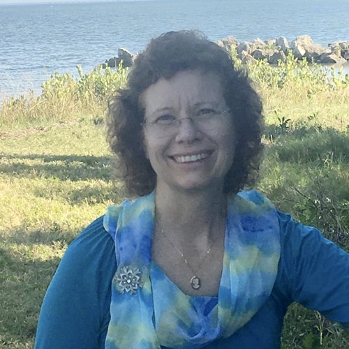 image of Cheri Moore outside by the ocean