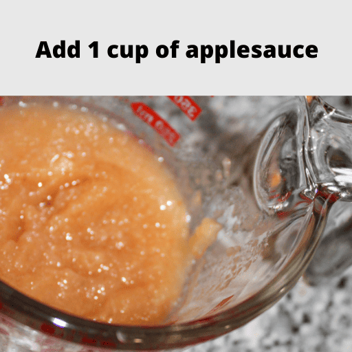 1 cup of applesauce in a glass measuring cup sitting on the counter. 