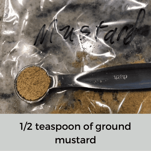 metal half teaspoon of ground mustard