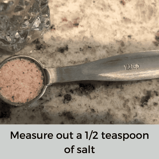 a half teaspoon of pink salt sitting on the countertop