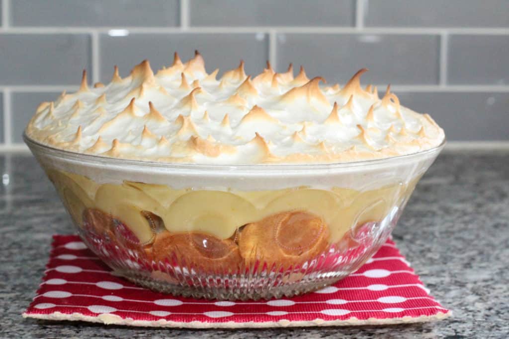Dairy and gluten free banana pudding in a crystal dish with browned meringue