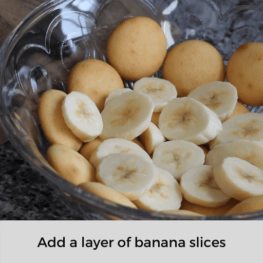 Pudding dish with a layer of gluten free wafers and sliced bananas