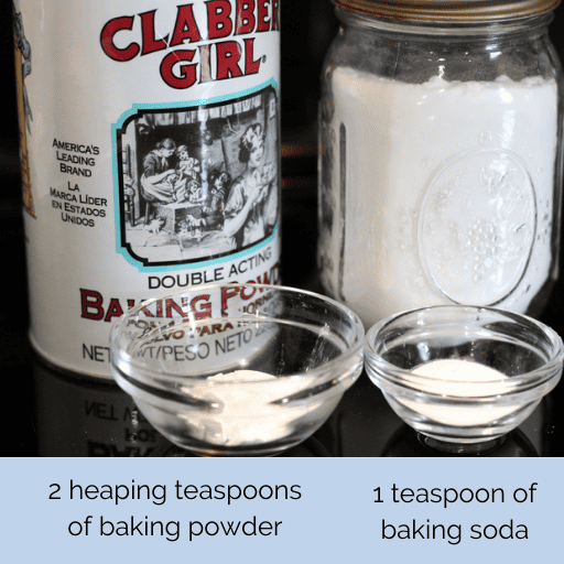 a container of baking powder next to a jar of baking soda. In front of them are small glass bowls filled with the amounts needed for the gluten and dairy free chocolate chip banana bread recipe.