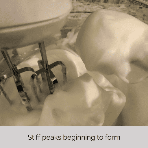 stiff peaks in the egg whites in the mixing bowl