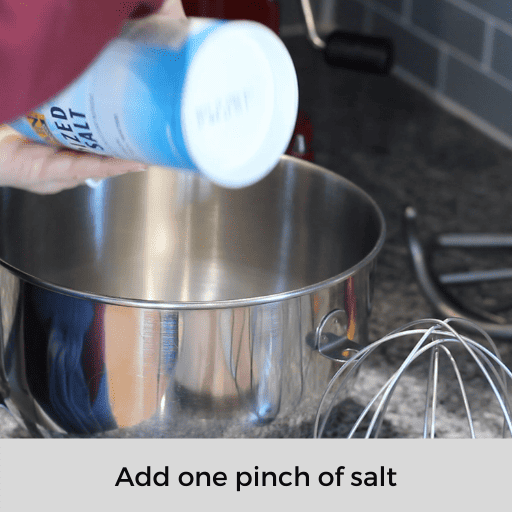Adding a pinch of salt to the mixing bowl