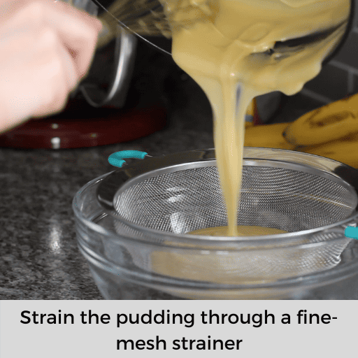 straining gluten and dairy free banana pudding through a fine-mesh strainer into a glass bowl.