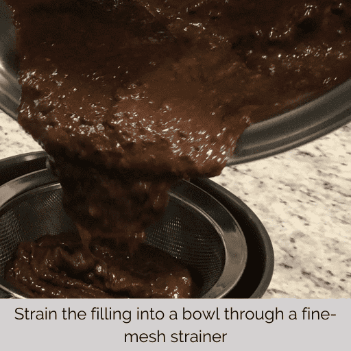 straining the pudding through a fine mesh strainer