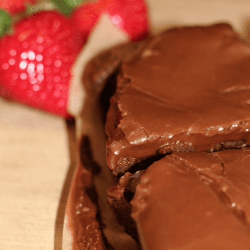 gluten and dairy free brownies topped with dairy free chocolate brownie icing