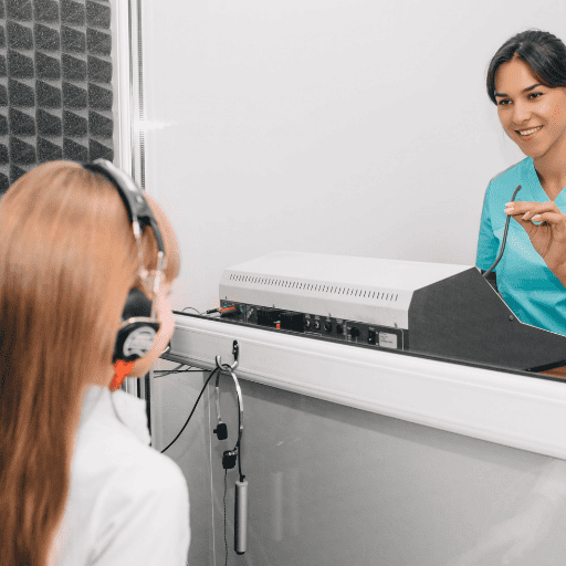 little girl taking a hearing test for sound sensitivities
