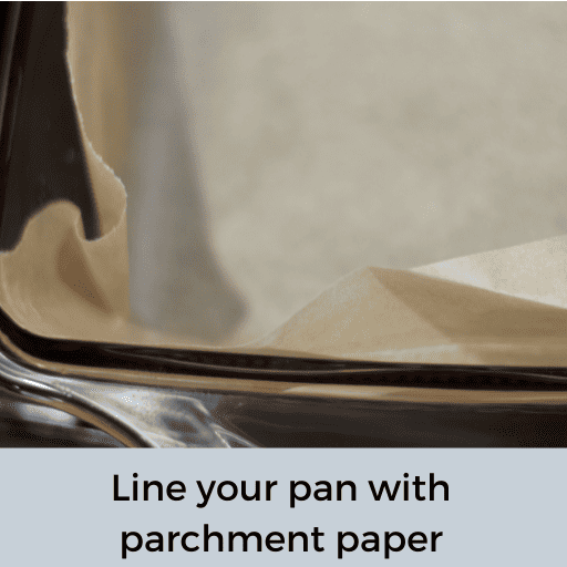 glass baking dish lined with parchment paper