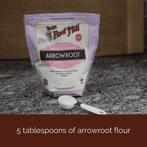 bag of arrowroot flour with a tablespoon sitting in front of it. 
