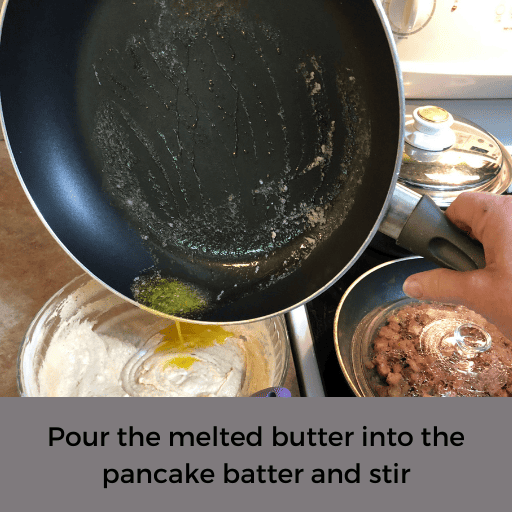 pouring melted butter from skillet into gluten and dairy free apple pancake batter