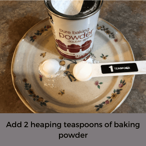 measuring 2 heaping teaspoons of baking powder