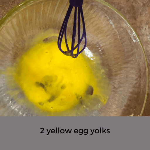 egg yolks in a glass mixing bowl