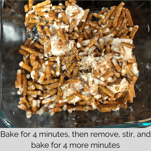slightly melted butter in a glass baking dish stirred with pretzels