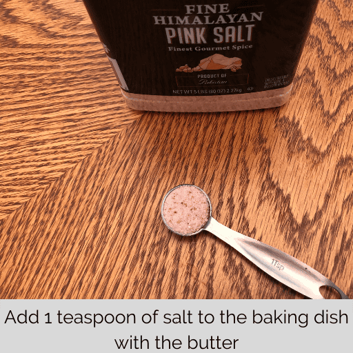 1 teaspoon of pink Himalayan salt on the wooden table