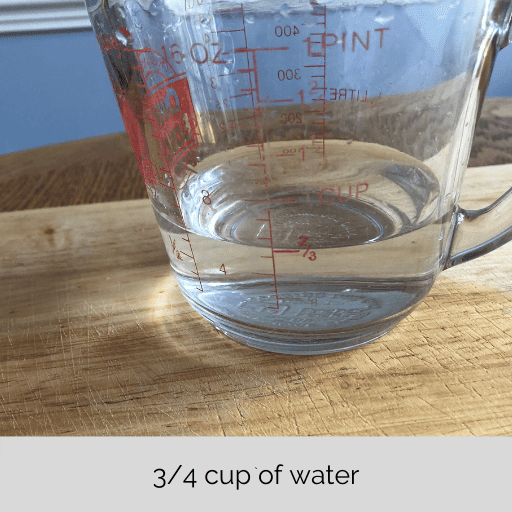 3/4 cup of water in a glass measuring cup