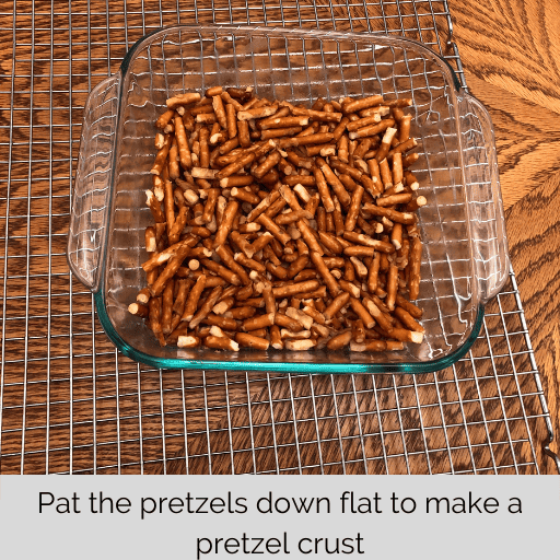 pretzel crust in a glass square dish for strawberry pretzel salad