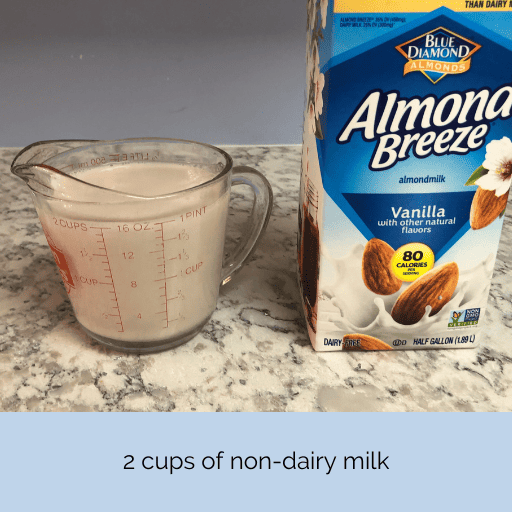 two cups of vanilla almond breeze milk in a glass measuring cup