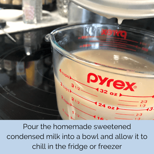 3 cups of homemade dairy free sweetened condensed milk in a large glass measuring cup sitting on a black glass stovetop