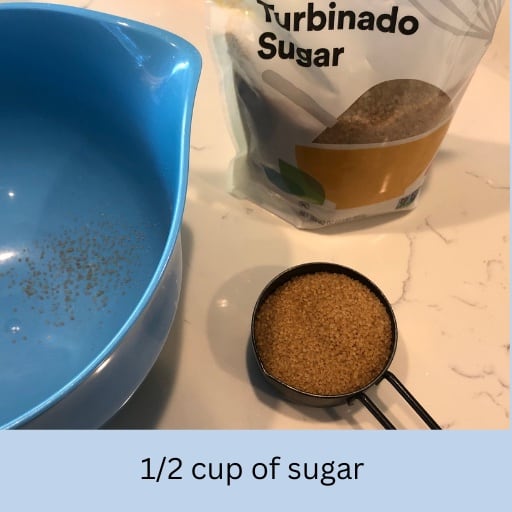 Measure 1/2 cup of sugar