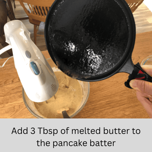 added melted vegan butter from a cast iron pan into the bowl of a stand mixer with gluten and dairy free pumpkin spice pancake batter in it.