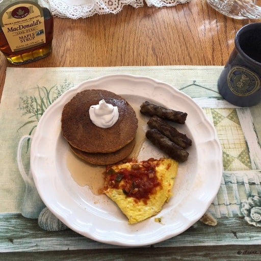 maple pumpkin spice pancakes with sausage and an omelette