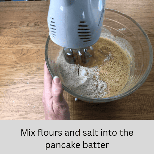 mixing gluten free flours and salt into the gluten and dairy free pumpkin spice pancake batter in a stand mixer